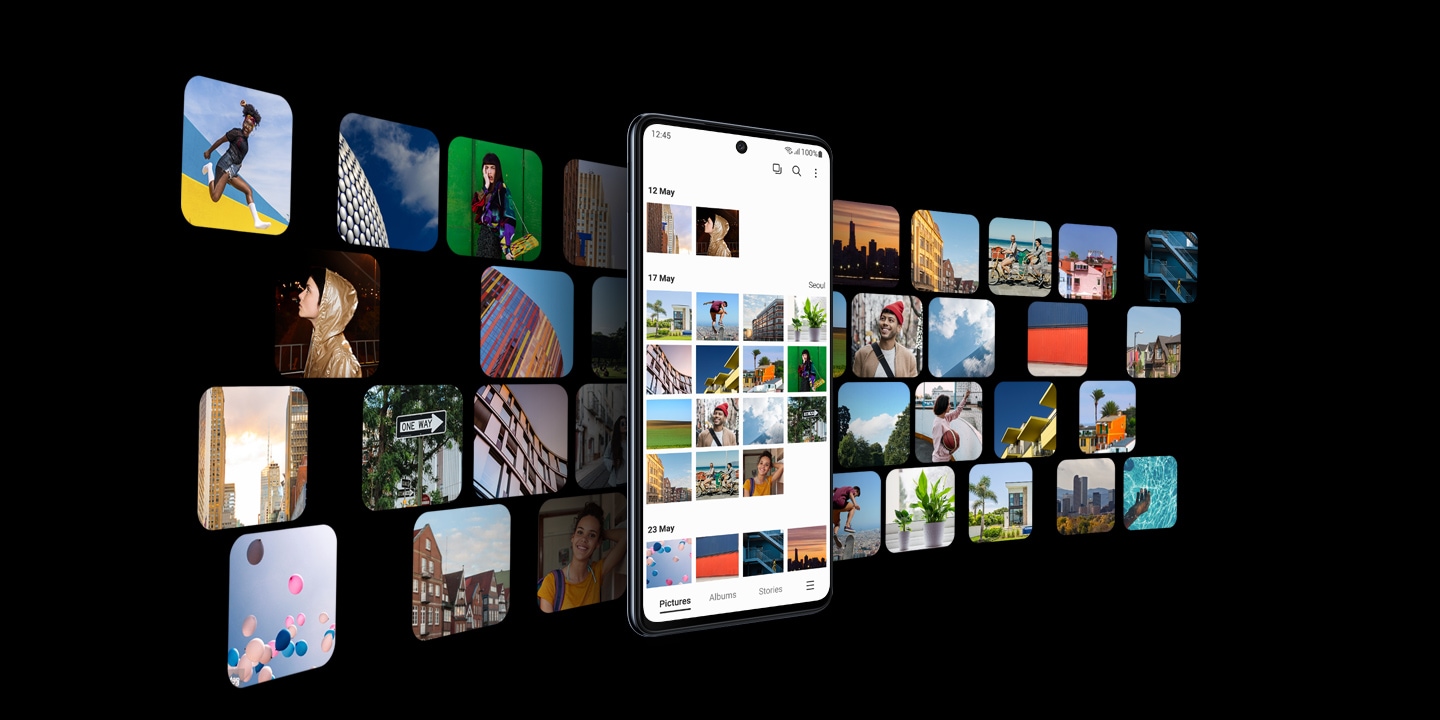 Galaxy M52 5G with the Gallery app onscreen is in the center. Numerous images are spread out in the background, representing that users can store their images and videos in Galaxy M52's spacious storage.
