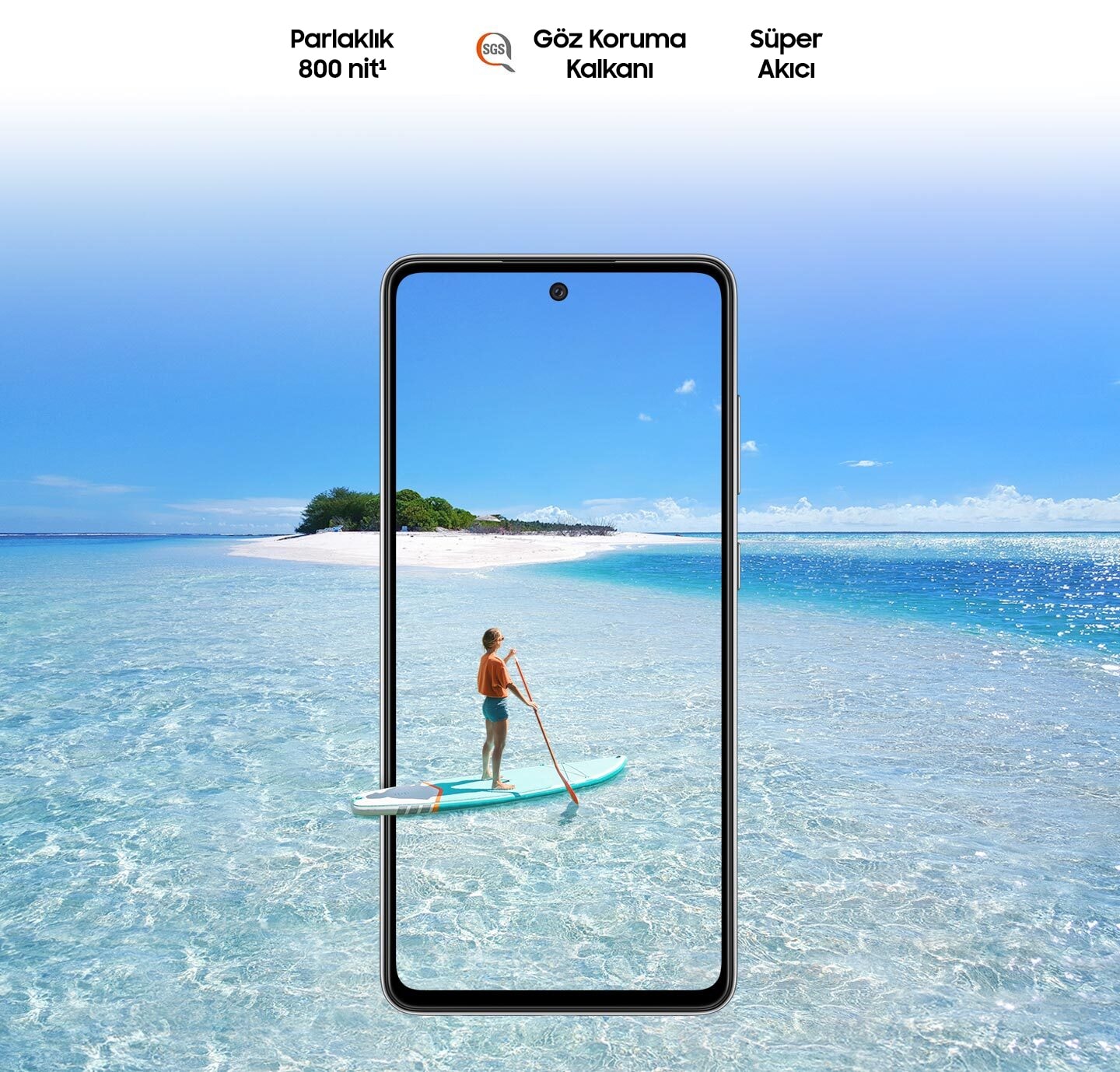 Galaxy A52s 5G seen from the front. Behind the phone and inside the display is a scene of a body of water and a small island. On the phone's screen is a person paddleboarding, and their paddleboard extends slightly outside the boundaries of the phone to represent the screen's immersive view. Text says Super Smooth, Brightness 800 nits and Eye Comfort Shield, with the SGS logo.